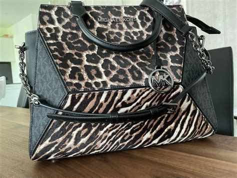 michael kors tasche mit leo fell|Michael Kors purses for women.